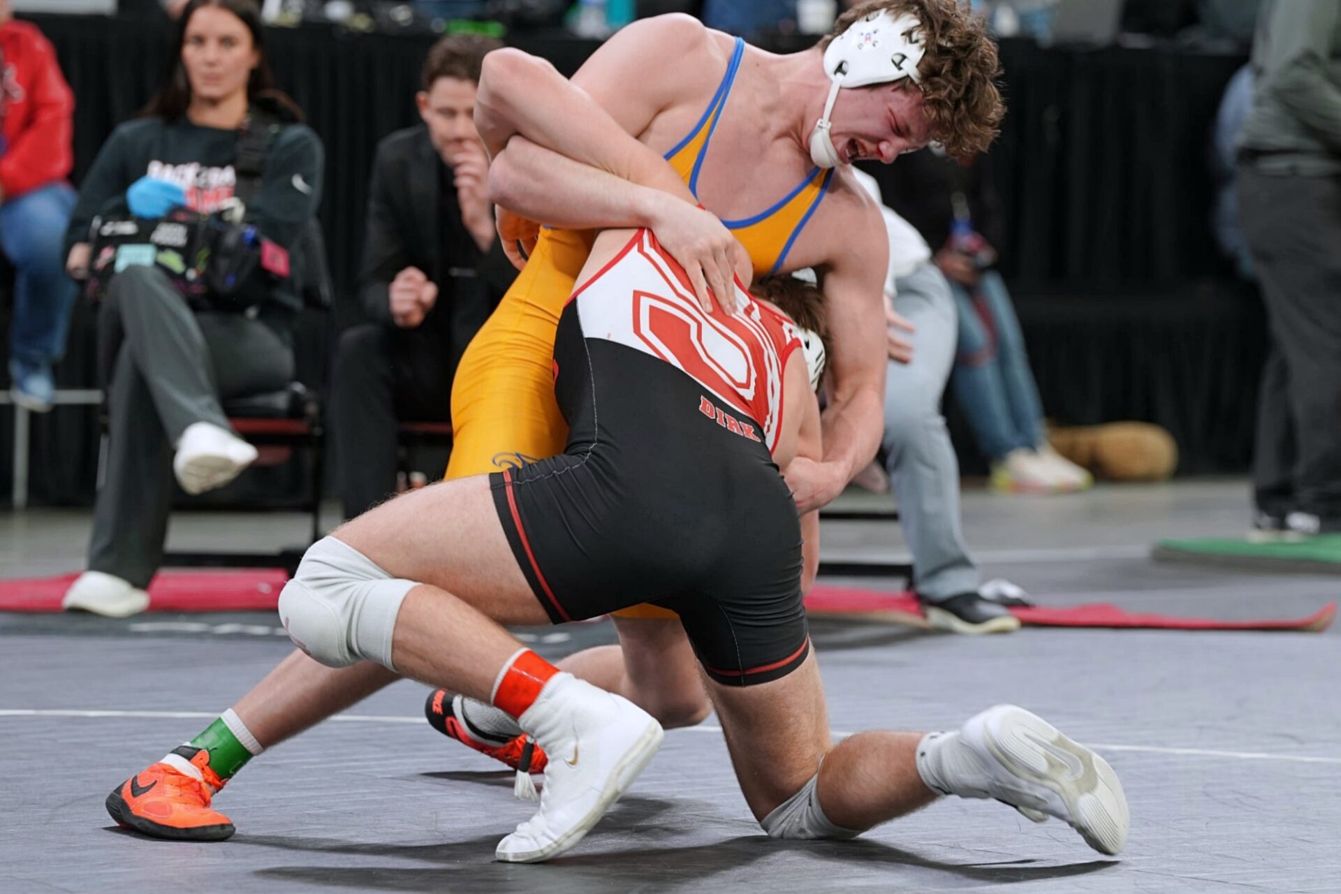 Aberdeen Central's Owen Ward battles Kelson Dirk of Sturgis in the Class A 190-pound state title match Saturday, Feb. 28 in Sioux Falls. Ward battled back from 10-1 and 11-4 deficits to capture a 14-11 victory in overtime. Photo by Kevin Foss for the Aberdeen Insider.