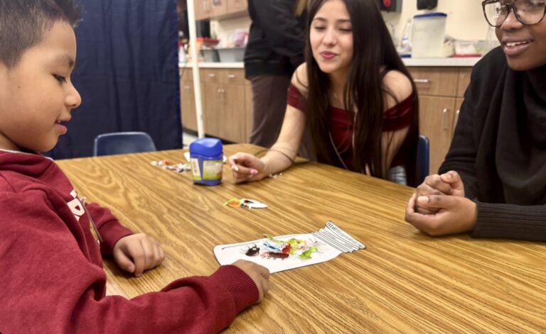 Central students Zoey Nelson, center, and Shenaz Suleiman entertain preschooler Ayden Jaimes during the first morning of Little Eagles Preschool at the ATEC Academy on Monday, March 2. Aberdeen Insider photo by Shannon Marvel.