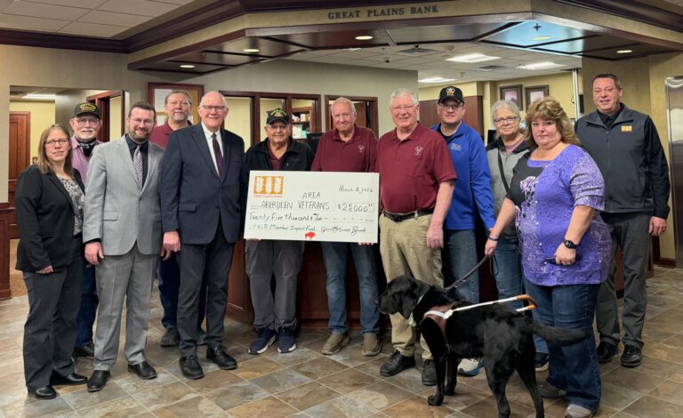 A $25,000 donation from Great Plains Bank gets Aberdeen Area Veterans a little bit closer to their goal of purchasing the depot on North Main Street. Pictured are, back row, from left, Susan Schaible-Heiser, Alan Ochsner, Joe Mehlhaff, Dale Strom, Pete Mehlhaff, Roger Schaible, Ron Krogman, Tom Croymans, Sean Johnson, Ruth VanSteinwyk, Shelley Ochsner and xxxx. Aberdeen Insider photo by Elisa Sand.