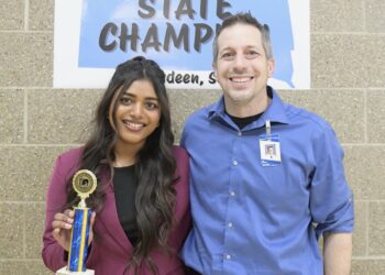 Aberdeen Central's Amna George earned her second straight Class AA state championship in Informative Speaking at the state high school speech and debate tournament last weekend in Aberdeen. She's pictured with Central coach Kerry Konda. Photo courtesy of Dakota Public Broadcasting.