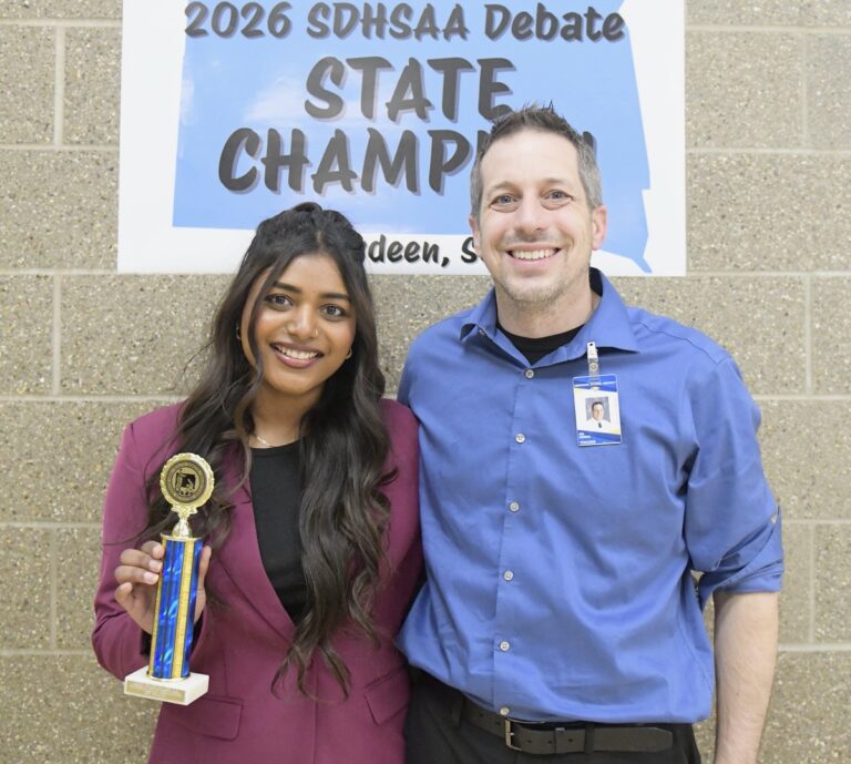 Aberdeen Central's Amna George earned her second straight Class AA state championship in Informative Speaking at the state high school speech and debate tournament last weekend in Aberdeen. She's pictured with Central coach Kerry Konda. Photo courtesy of Dakota Public Broadcasting.