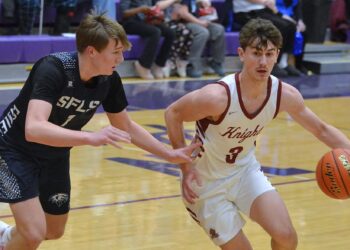 Aberdeen Christian's Luke Kaiser has the inside track to the basket against Sioux Falls Lutheran's Kade Matthies during their Class B SoDak 16 game Tuesday, March 10 at the Watertown Civic Arena. Kaiser had 15 points as Aberdeen Christian won 67-52 to qualify for the State B. Courtesy photo.