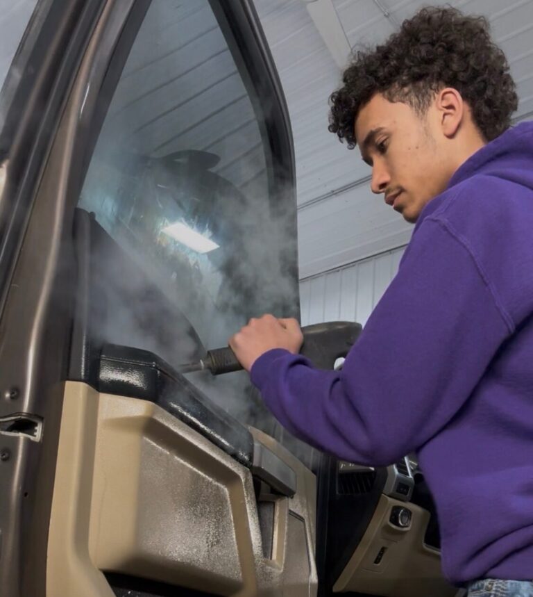 Trey Johnson details a vehicle at his Aberdeen business Prime Auto Detailing. Courtesy photo.