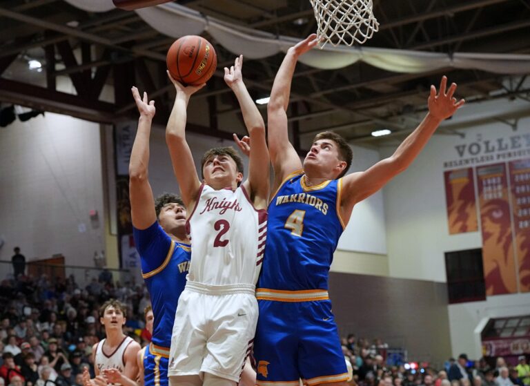 Aberdeen Christian's Grady Jett goes up for a shot in between Castlewood's Brody Bass (4), and Leonard Wernke during the Class B Boys State Tournament quarterfinal Thursday, March 19 inside the Barnett Center. Castlewood came away with a 53-50 win. Photo by Kevin Foss for the Aberdeen Insider.