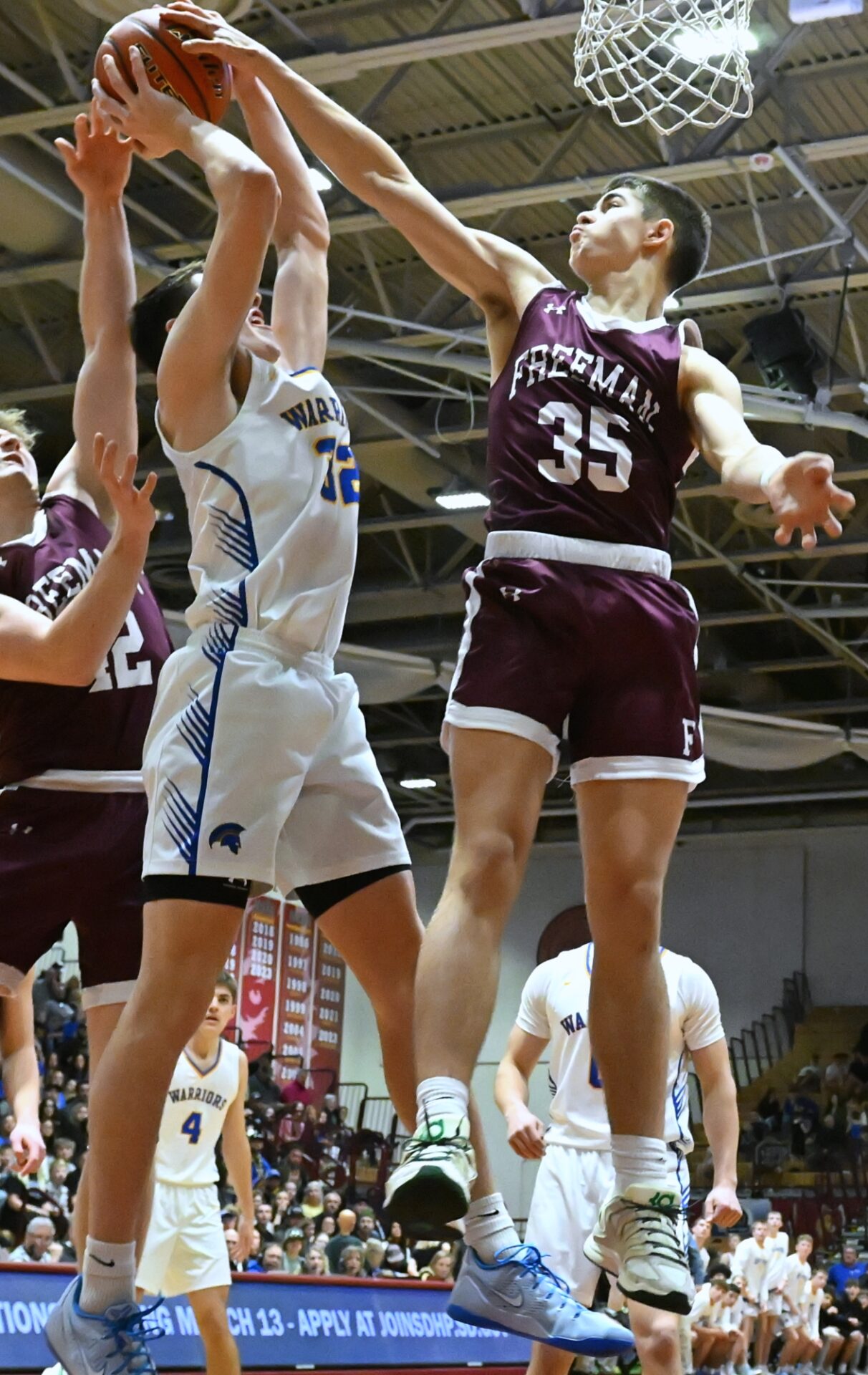 Freeman's David Walter blocks the shot of Castlewood's Will Aderhold during their Class B Boys State championship game Saturday, March 21 inside the Barnett Center. Photo by Kevin Foss for the Aberdeen Insider.