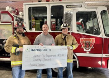 BankNorth Warner helped procure a $70,000 grant for the Warner Volunteer Fire Department. Keith Knuppe, center, senior vice president at BankNorth's Warner branch, poses for a photo with Will Rozell, left, and Austin Nath, who are both volunteers with the fire department. Courtesy photo.