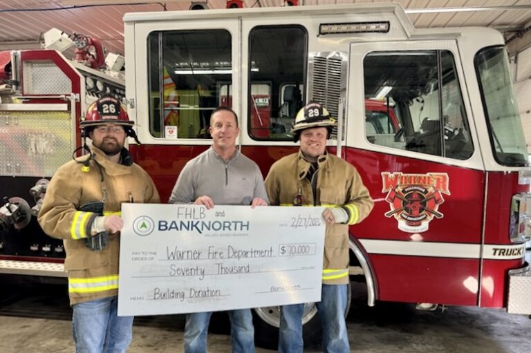 BankNorth Warner helped procure a $70,000 grant for the Warner Volunteer Fire Department. Keith Knuppe, center, senior vice president at BankNorth's Warner branch, poses for a photo with Will Rozell, left, and Austin Nath, who are both volunteers with the fire department. Courtesy photo.