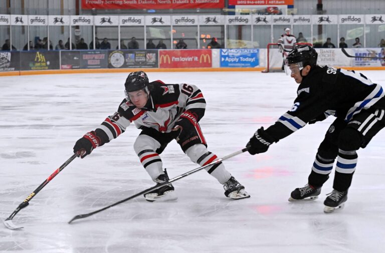 Aberdeen forward Tevan James reaches for the puck while being defended by St. Cloud's Avry Shaw Saturday, March 28 inside the Odde Ice Center. The Norsemen skated to a 5-1 win and swept the weekend series. Aberdeen Insider photo by Robb Garofalo.