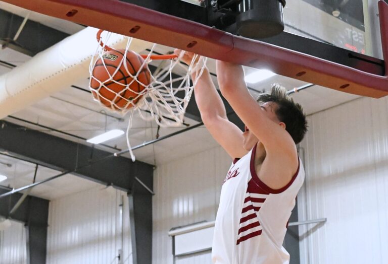 Aberdeen Christian's Brooks Jett dunks the ball during a game against Hitchcock-Tulare this season. Jett was named to the Class B all-state second team. Aberdeen Insider photo by Robb Garofalo.