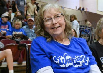 Castelwood's Dawn Sikkink sits courtside during the 2026 Class B Boys State Basketball Tournament. Sikkink has been a mainstay at the Barnett Center for State B since 1996. Aberdeen Insider photo by Robb Garofalo.
