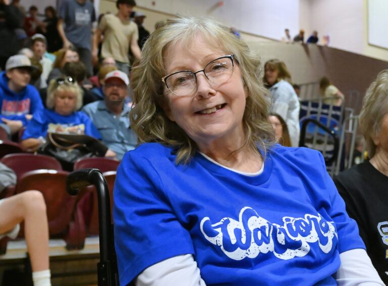 Castelwood's Dawn Sikkink sits courtside during the 2026 Class B Boys State Basketball Tournament. Sikkink has been a mainstay at the Barnett Center for State B since 1996. Aberdeen Insider photo by Robb Garofalo.