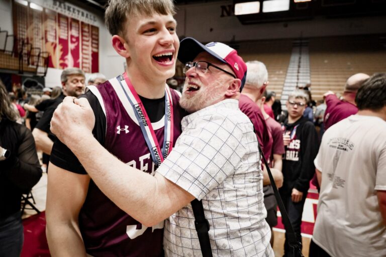 Freeman basketball player Oliver Waltner and Scott Waltman share a hug and a laugh after the Flyers won the State B boys basketball tournament at the Barnett Center on Saturday, March 21. Photo courtesy of Jeremy Waltner.