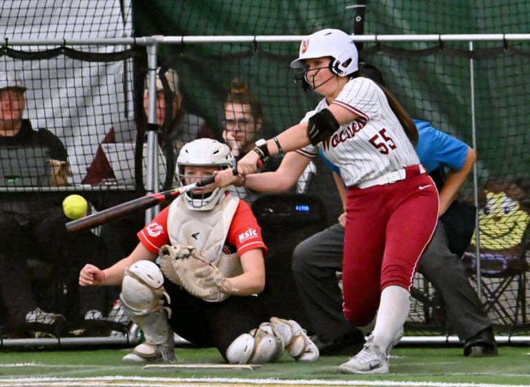 Northern State's Alicia Jeanson reaches out and makes contact on a pitch against Minnesota State Moorhead Saturday, April 4 inside the Aberdeen Dome. The Wolves split the series, winning game one 6-5 then losing game two 8-0. Aberdeen Insider photo by Robb Garofalo.