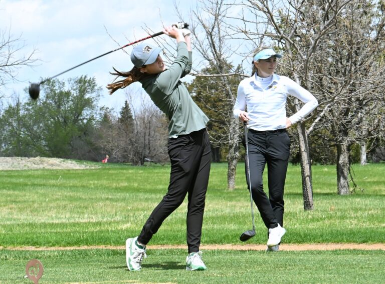 Aberdeen Roncalli's Claire Crawford follows through on a tee shot during the 2025 Hub City Invitational in Aberdeen. She was the runner-up at the Class A state girls golf tournament a year ago as the Cavaliers finished third as a team. Aberdeen Insider photo by Robb Garofalo.