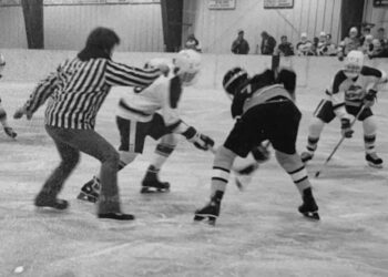 Lowell Swanson drops the puck during an Aberdeen Cougars game against Watertown in 1983 at the Holum Expo Building. Swanson was induced into the South Dakota Amateur Hockey Association Hall of Fame this year. Courtesy photo.
