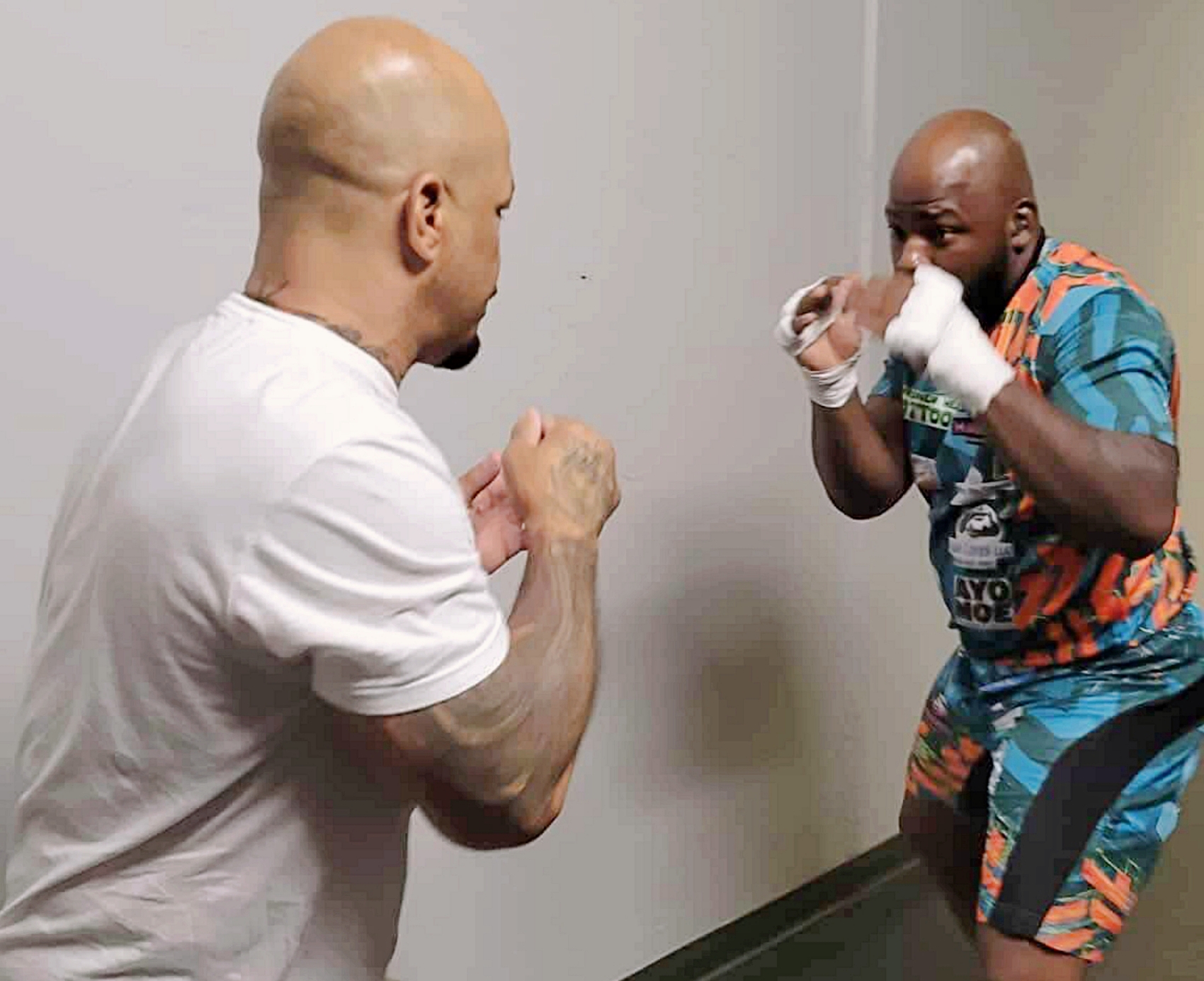 Aberdeen's Corey "King Smilez" McIntosh, right, does light sparring with former UFC heavyweight fighter Houston Alexander. McIntosh boxes Cayman Audie Saturday, April 25 for the vacant Ignite Fights USA Minnesota heavyweight title. Courtesy photo.