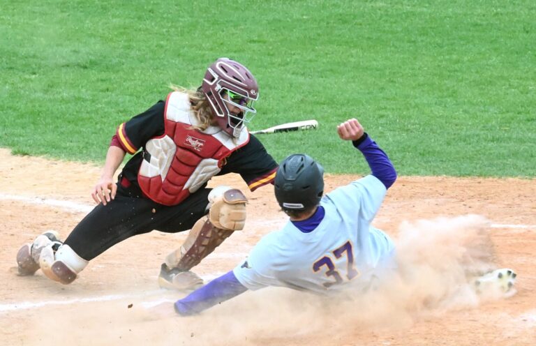 Northern State catcher Gehrig Larrigan puts the tag on Minnesota State Mankato's Owen Sikkini at home to get the out Saturday, April 25 at Fossum Field. Northern lost 13-2 and was swept in a three game series. Aberdeen Insider photo by Robb Garofalo.