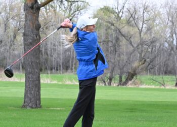 Aberdeen Central's Emma Dohrer watches her tee shot on the par-five 18th hole during the Hub City Invitational Thursday, April 30 at Moccasin Creek Country Club. Central won the event. Aberdeen Insider photo by Robb Garofalo.