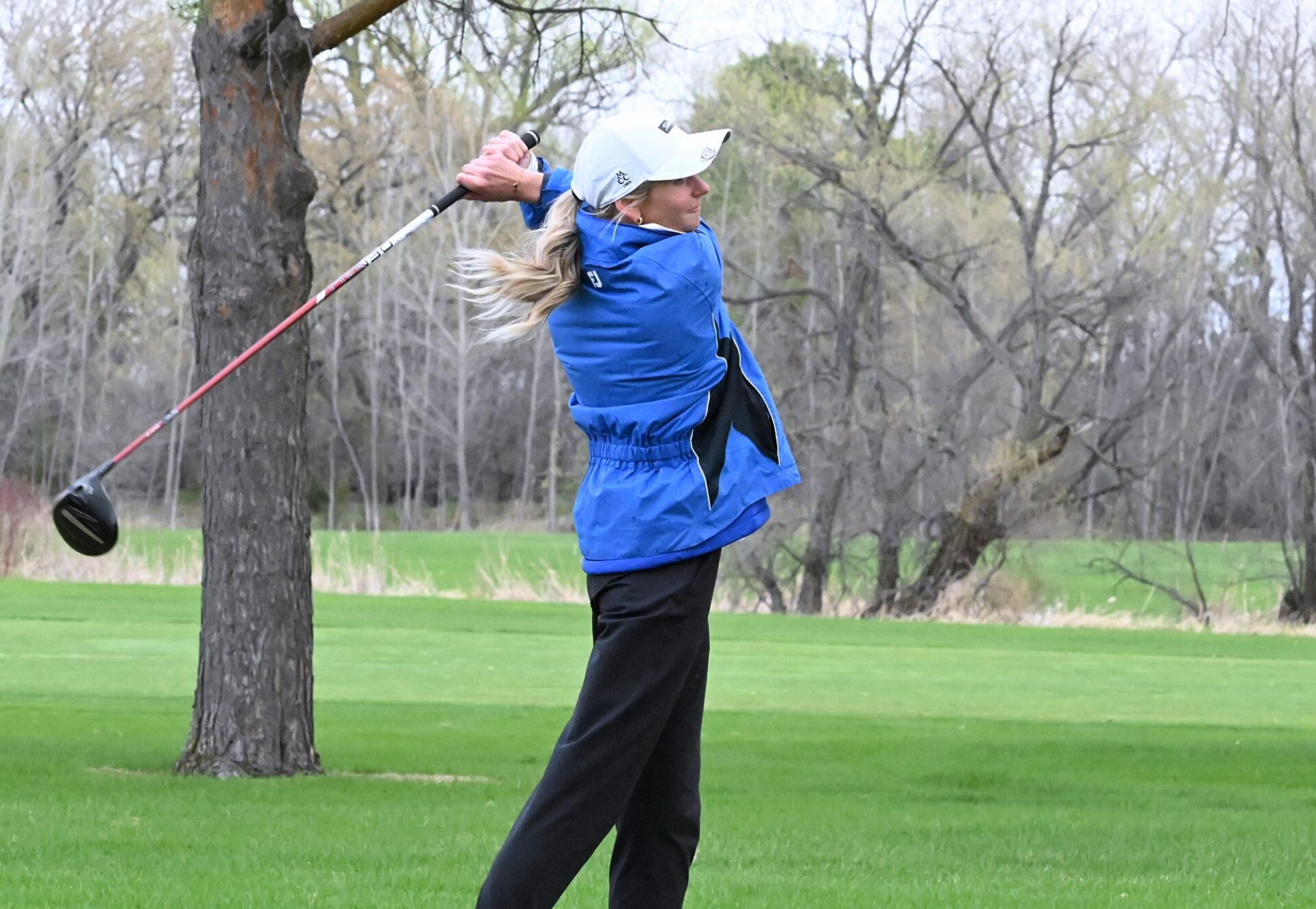 Aberdeen Central's Emma Dohrer watches her tee shot on the par-five 18th hole during the Hub City Invitational Thursday, April 30 at Moccasin Creek Country Club. Central won the event. Aberdeen Insider photo by Robb Garofalo.