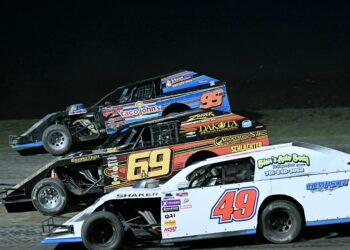 Zander Compson (49), Britt Williams (69) and James Irwin (99) battle for position around turn turn three during the Midwest Modified feature Friday, May 1 at the Brown County Speedway. Aberdeen Insider photo by Robb Garofalo.