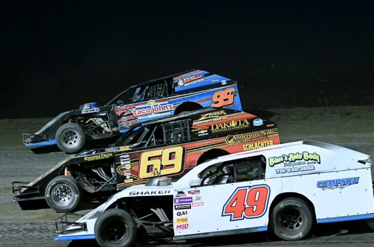Zander Compson (49), Britt Williams (69) and James Irwin (99) battle for position around turn turn three during the Midwest Modified feature Friday, May 1 at the Brown County Speedway. Aberdeen Insider photo by Robb Garofalo.