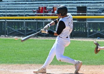 Aberdeen first baseman JaSean Rivera hits a single to center during game one of the Smittys doubleheader sweep over Rapid City Central Sunday, May 3 at Fossum Field. Aberdeen Insider photo by Robb Garofalo.