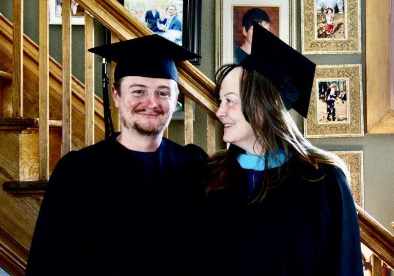Dominic Coughlin, left, poses for a photo alongside his mom Michele Coughlin in their graduation gowns and mortarboards. They will both earn degrees from Northern State University on Saturday, May 9 before celebrating Mother's Day on Sunday, May 10. Aberdeen Insider photo by Shannon Marvel.