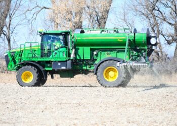 A spray rig takes on product as it completes application of fertilizer before farmers start planting this spring. Photo courtesy of Agtegra.