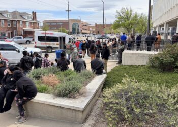 An overflow crowd waits to get through security on May 4, 2026, before a hearing at the federal courthouse in Rapid City, South Dakota. After the hearing, a judge granted a temporary restraining order against exploratory drilling for graphite near Pe' Sla in the Black Hills. South Dakota Searchlight photo by Seth Tupper.