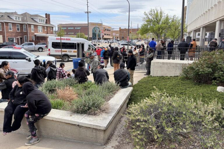 An overflow crowd waits to get through security on May 4, 2026, before a hearing at the federal courthouse in Rapid City, South Dakota. After the hearing, a judge granted a temporary restraining order against exploratory drilling for graphite near Pe' Sla in the Black Hills. South Dakota Searchlight photo by Seth Tupper.