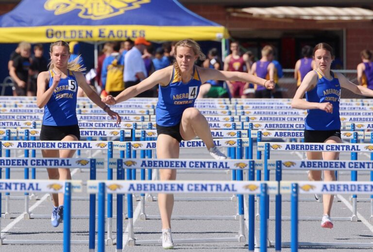 Aberdeen Central's Mya Arampatzis, center, won the girls 100-meter hurdles at the Al Sahli Invitational Friday, May 8 at Brownell Activities Complex. Teammates Catelynn Weig, right, and Espynn Kuhfeld finished second and third, respectively. Photo by Allie Hoekeman for The Aberdeen Insider.