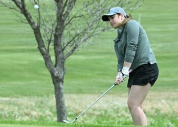 Aberdeen Roncalli's Ava Danielson watches her chip on the par-five ninth hole during the Groton Invitational Monday, May 11 at the Olive Grove Country Club. Danielson's 89 helped Roncalli get the team win. Aberdeen Insider photo by Robb Garofalo.