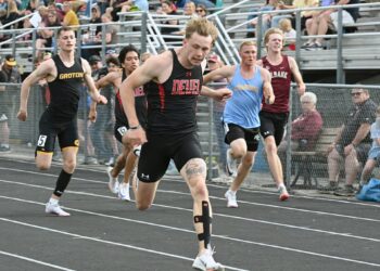 Deuel's Oliver Fieber crosses the line first in the 100-meter dash Thursday, May 14 during the Northeast Conference track meet in Milbank. Fieber set a new meet record, finishing in 10.55 seconds. Aberdeen Insider photo by Robb Garofalo.