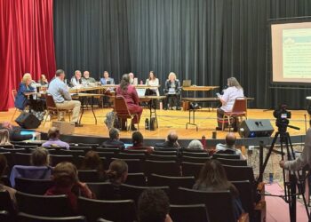 Elizabeth Lone Eagle, far right, speaks to the South Dakota Board of Minerals and Environment at the first day of a hearing on an exploratory drilling permit on May 18, 2026, at the Mueller Civic Center in Hot Springs. South Dakota Searchlight photo by Meghan O’Brien.
