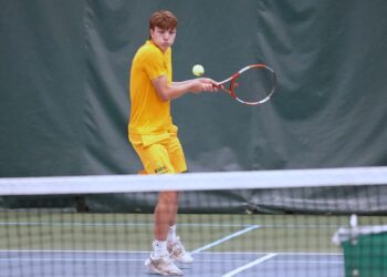 Aberdeen Roncalli's Linus Johnson lines up a backhand during the Class A boys state tennis tournament in Rapid City. Johnson took fifth at No. 3 singles. Photo courtesy South Dakota Public Broadcasting.