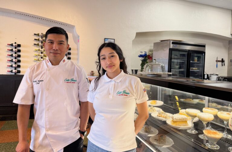 Franklin Ramos, left, stands with the server at Costa Brava, Allison Fernandez. Costa Brava opened downtown on May 16. Aberdeen Insider photo by Elisa Sand.