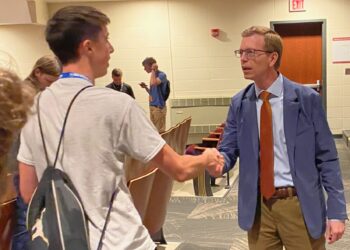 U.S. Rep. Dusty Johnson greets South Dakota Boys State Student during a photo session after a question and answer session Monday, May 25, at the Johnson Fine Arts Center in Aberdeen. Johnson answered questions on education, workforce development, and his political campaign for SD governor. Photo by Jason Lopez Martinez.