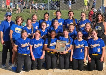 The Redfield softball team poses with its state tournament qualifying trophy after defeating Baltic 6-5 in the Class B SoDak 16 Tuesday, May 26 in Baltic. Redfield will open the tournament Thursday, June 4 against McCook Central/Montrose. Courtesy photo.