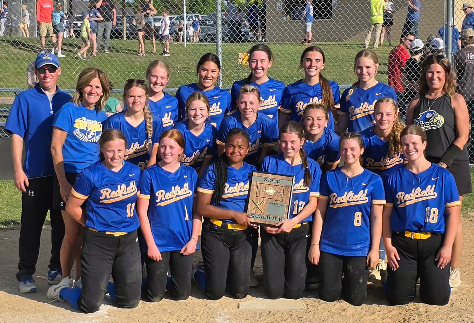 The Redfield softball team poses with its state tournament qualifying trophy after defeating Baltic 6-5 in the Class B SoDak 16 Tuesday, May 26 in Baltic. Redfield will open the tournament Thursday, June 4 against McCook Central/Montrose. Courtesy photo.