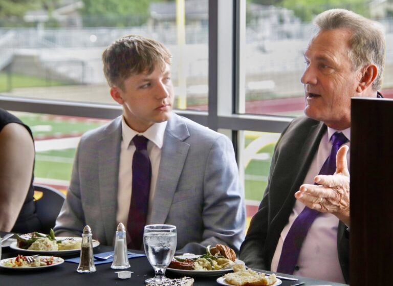 Coltyn Raymond of Ethan, left, was elected 2026 South Dakota Boys State governor during the annual government, leadership and citizenship program at Northern State University. He was honored during a banquet on Thursday, May 28 where he met South Dakota Gov. Larry Rhoden. Aberdeen Insider photo by Jason Lopez Martinez.