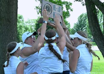 Members of the Aberdeen Central girls golf team celebrate their second-consecutive Class AA state championship Tuesday, June 2 at Cattail Crossing Golf Course in Watertown. Aberdeen Insider photo by Robb Garofalo.
