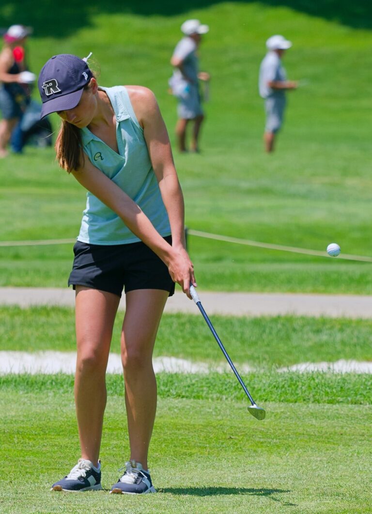 Aberdeen Roncalli's Claire Crawford chips onto the green during the Class A Girls State Golf Tournament Monday, June 1 at the Two Rivers Golf Course in North Sioux City. Roncalli placed fifth as a team when play concluded Tuesday, June 2.  Photo courtesy South Dakota Public Broadcasting.
