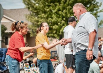 Toby Doeden of Aberdeen, right, shakes hands with people during a stop in Harrisburg. Doeden is seeking the Republican Party's nomination for governor. Photo courtesy of Toby Doeden for South Dakota.