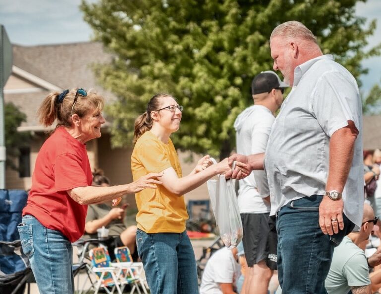 Toby Doeden of Aberdeen, right, shakes hands with people during a stop in Harrisburg. Doeden is seeking the Republican Party's nomination for governor. Photo courtesy of Toby Doeden for South Dakota.
