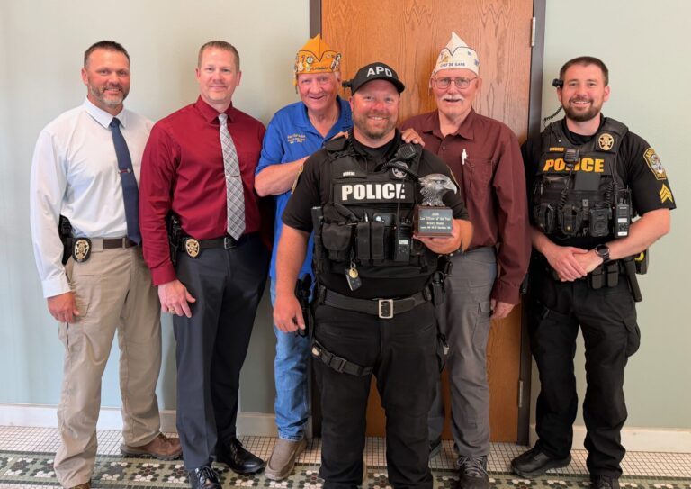 Aberdeen police officer Brady Woehl, center, front, has been recognized as the local and state officer of the year by the Forty & Eight veteran organization. With him are, from left, Police Capt. Tony Bisbee, Police Chief Tanner Jondahl, Ron Krogman and Alan Ochsner from the Forty & Eight, and Police Sgt. Cole Kissner. Courtesy photo.