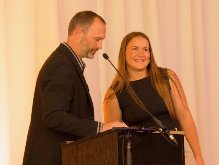 Aberdeen Development Corp. CEO Tim Hanigan stands with Madi Jones, this year's winner of the Aberdeen Pitch Contest. Aberdeen Insider photo by Elisa Sand.