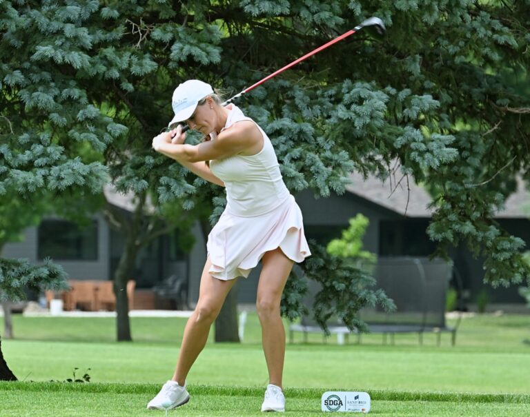 Aberdeen's Olivia Braun leans into her tee shot on the 10th hole during round of the Sanford Series Northeast Invitational Monday, July 6 at Moccasin Creek Country Club. Braun carded a two-day total 141 to win the event. Aberdeen Insider photo by Robb Garofalo.