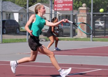 Aberdeen's Sarah Knie moves towards the net to hit a forehand volley during the C.C. Lee Tennis Tournament Monday, July 6 at the Northern State tennis courts. Aberdeen Insider photo by Allie Hoekman.