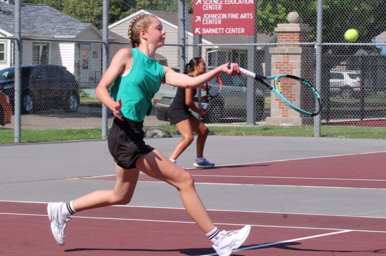 Aberdeen's Sarah Knie moves towards the net to hit a forehand volley during the C.C. Lee Tennis Tournament Monday, July 6 at the Northern State tennis courts. Aberdeen Insider photo by Allie Hoekman.