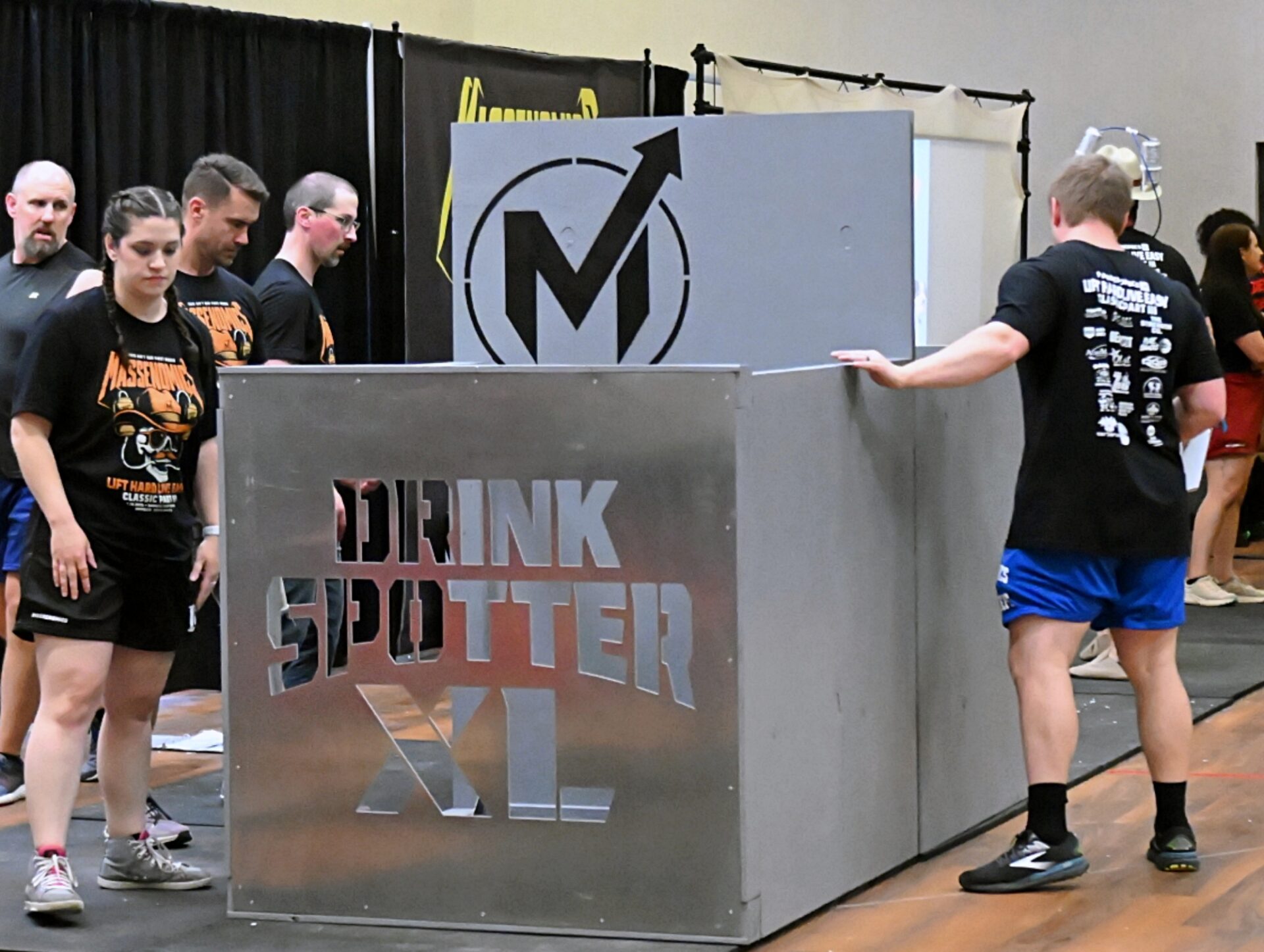 Competitors check out the Drink Spotter apparatus during the Lift Hard, Live Easy strongman competition Saturday, July 19, 2025, at the Best Western Ramkota. This year's event is Friday, July 17 and Saturday, July 18. Aberdeen Insider photo by Robb Garofalo.